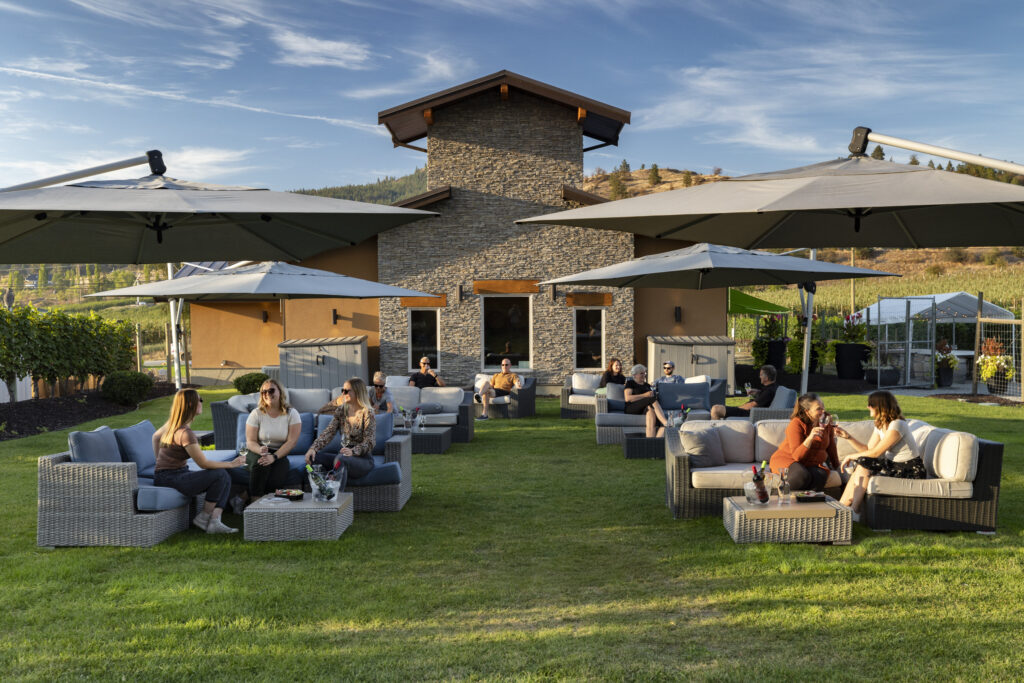 Guests enjoying live outdoor music at Intrigue Wines during the summer Music in the Vines concert series in Lake Country.